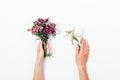 Woman`s hands holding small bouquet and tiny gift box Royalty Free Stock Photo