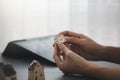 Woman`s hands holding wooden cube show happy face side for satisfaction survey Royalty Free Stock Photo