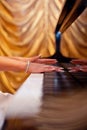 Woman's hands on the keyboard of the piano Royalty Free Stock Photo