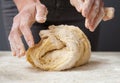 Woman's hands knead dough