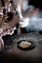 Woman`s hands knead the dough on the table with flour and ingredients. Royalty Free Stock Photo