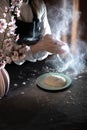 Woman`s hands knead the dough on the table with flour and ingredients. Royalty Free Stock Photo