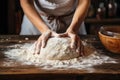 Woman\'s hands kneading dough close up
