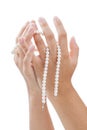 Woman's hands with a pearl