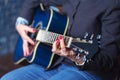 Woman`s hands playing acoustic guitar, close up Royalty Free Stock Photo
