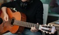 Woman`s hands playing acoustic guitar, close up.concept of recreation Royalty Free Stock Photo