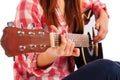 Woman's hands playing acoustic guitar, close up Royalty Free Stock Photo