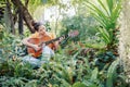 Woman`s hands playing acoustic guitar have fun outdoor, close up Royalty Free Stock Photo