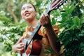 Woman`s hands playing acoustic guitar have fun outdoor, close up Royalty Free Stock Photo