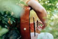 Woman`s hands playing acoustic guitar have fun outdoor, close up Royalty Free Stock Photo