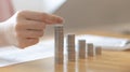 Woman`s hands put the coins arranged in steps, Managing your finances or saving money for future use