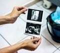 Female hands, showing scan 3D photo of unborn child Royalty Free Stock Photo