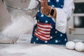 Woman's hands sifting flour through sieve. Selective focus. Royalty Free Stock Photo