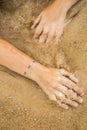 Woman's hands with sticker tatoo in the sea