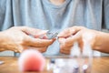 Woman's hands about to cut her long natural nails with pliers Royalty Free Stock Photo