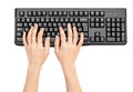 Woman`s hands typing on computer keyboard on white background Royalty Free Stock Photo