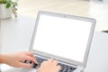 Woman`s hands typing on a keyboard with blank screen laptop