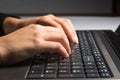 Woman`s hands using a laptop, close up Royalty Free Stock Photo