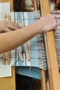 Woman`s hands and wooden loom tools Royalty Free Stock Photo