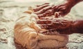 Woman's hands with work with dough in the kitchen. Kneading homemade dough with flour for bread, pastry or pizza Royalty Free Stock Photo