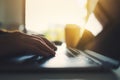 A woman`s hands working and typing on laptop computer on the table Royalty Free Stock Photo