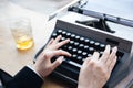 Woman's hands writing on old typewriter Royalty Free Stock Photo