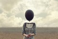 Woman`s head replaced by a black balloon Royalty Free Stock Photo