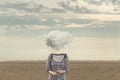 Woman`s head Replaced by a soft cloud in a surreal situation Royalty Free Stock Photo