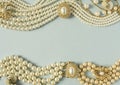 Woman`s Jewelry. Vintage jewelry background. Beautiful gold tone and pearls brooches, braceletes, necklaces and earrings on blue Royalty Free Stock Photo
