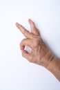 Woman`s left hand symbol meaning ` OK ` on white background, Asian body skin part, Symbol, Gesturing, Body Language