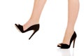 Woman's leg in high heels trying to trample something Royalty Free Stock Photo