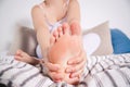Woman`s leg hurts, pain in the foot, massage of female feet Royalty Free Stock Photo