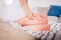 Woman`s leg hurts, pain in the foot, massage of female feet Royalty Free Stock Photo