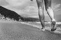 Woman's legs close-up during a walk on a beach Royalty Free Stock Photo