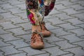Woman`s legs with colorful trousers and shoes