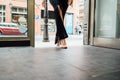 Woman`s legs entering a shop Royalty Free Stock Photo