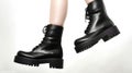 Woman\'s Legs Rocking Black Combat Boots on a High Heel Platform. Generative AI