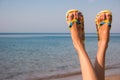 Woman`s legs and sea.