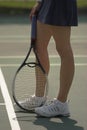 Woman's legs on tennis court