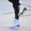 Woman's Legs in White Ice Skates Royalty Free Stock Photo