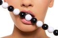 Woman's lips with black and white beads
