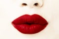 Woman`s lips with lipstick and kiss close up view