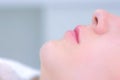 Woman`s lips after permanent makeup microblading procedure, closeup side view. Royalty Free Stock Photo