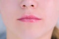 Woman`s lips after permanent makeup microblading procedure, closeup view. Royalty Free Stock Photo