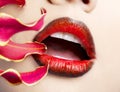 Woman's lips with red flower Royalty Free Stock Photo