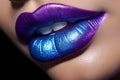 Woman\'s lips with unusual purple and blue lipstick