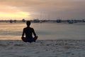 Woman meditating on the beach in Boracay island, Philippines Royalty Free Stock Photo
