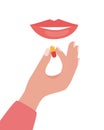 Woman`s mouth and hand with a pill. Woman taking a pill. Girl holds a pill in her hand and intends to take it. Medication