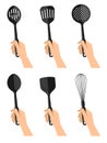 Woman`s nahds with black kitchen utensils isolated on white back