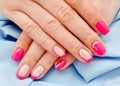 Woman`s nails with beautiful pink manicure fashion design